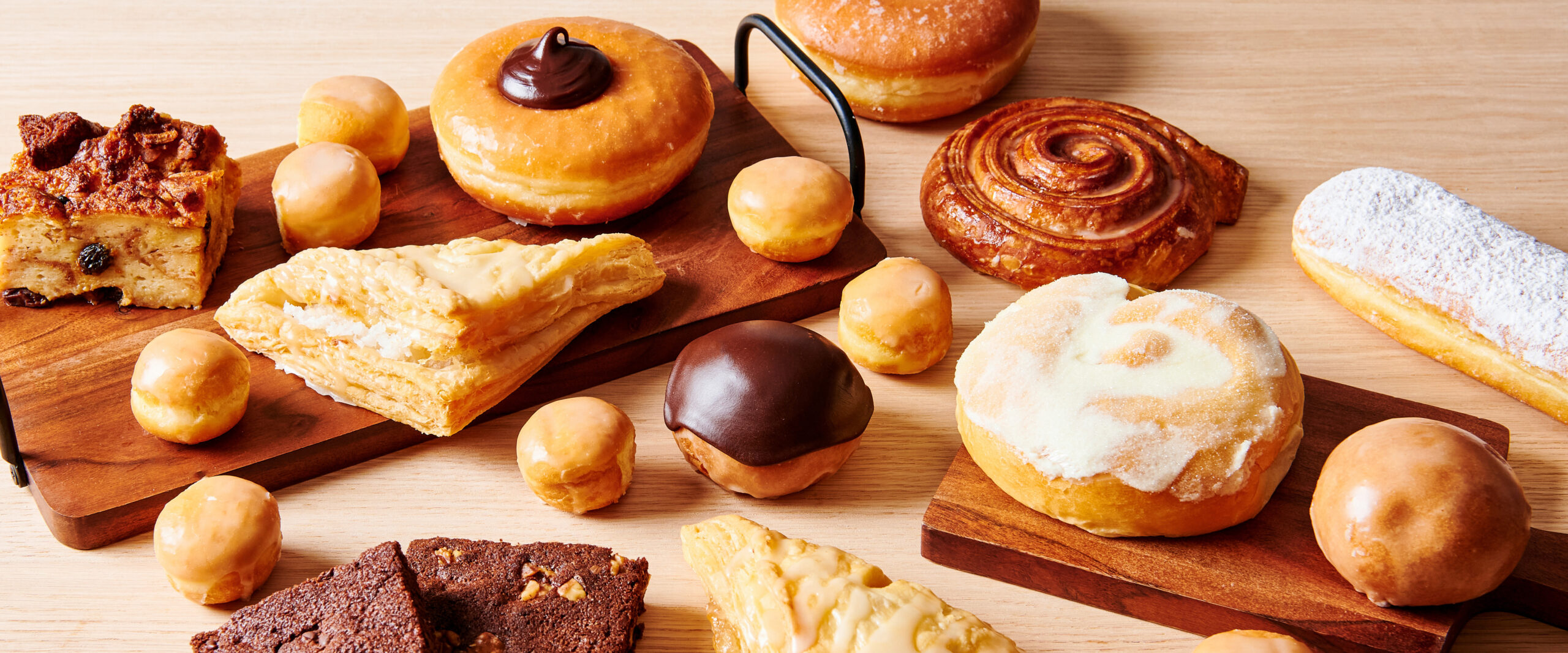 Flaky golden croissants and delicate pastries arranged for breakfast